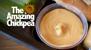individual serving of apple cinnamon chickpea spread on platter with celery