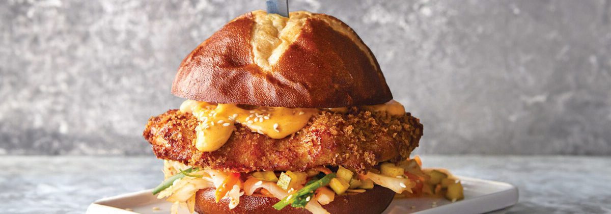 prepared chicken sandwich on white plate