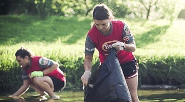 two women cleaning outdoors