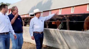 3 men on tour of ranch